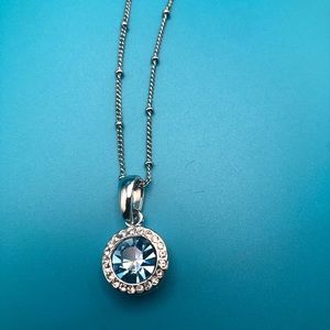 Silver necklace with blue stone and faux diamonds
